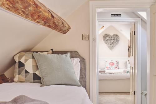 a bedroom with a bed and a heart wall at Sandy Hill Farm in Curborough