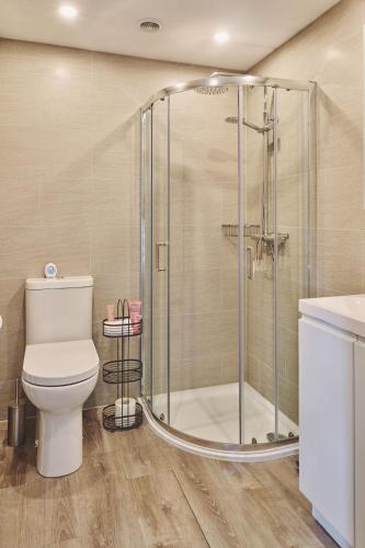 a bathroom with a shower and a toilet at Sandy Hill Farm in Curborough
