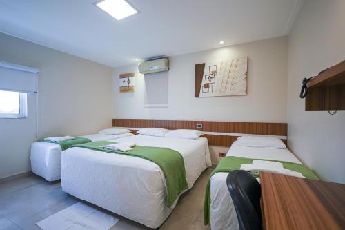 Postel nebo postele na pokoji v ubytování Hotel Imperatriz