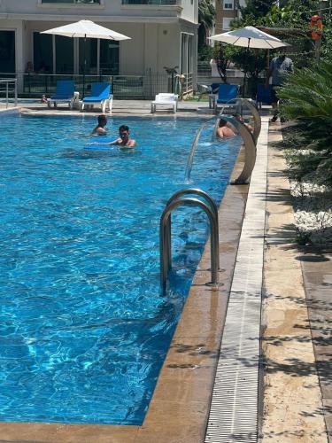 a group of people in a swimming pool at AQUA CİTY SUİT in Antalya