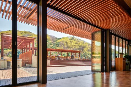 a view from the outside of a house with a wooden roof at Healience Village in Hongcheon