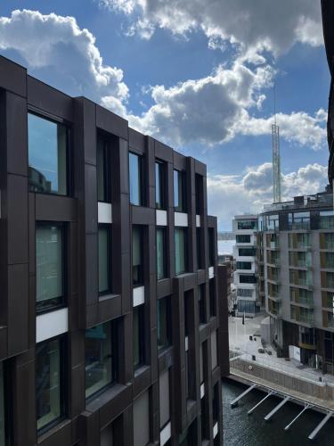 a view of a building from a balcony at Kanalen 3 Tjuvholmen in Oslo