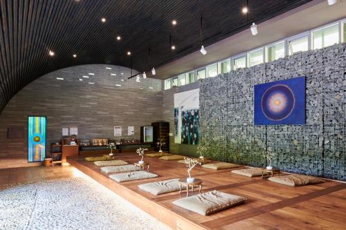 a room with several pillows on a wooden floor at Healience Village in Hongcheon