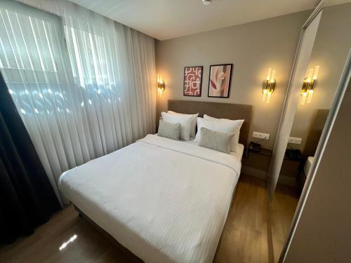 Letto o letti in una camera di Weingart Suites Hotel