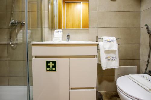 a bathroom with a sink and a toilet at Comtesse Lisbonne Guest House by Homing in Lisbon
