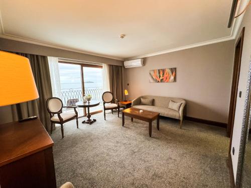 a living room with a couch and a table at La Quinta by Wyndham Giresun in Giresun
