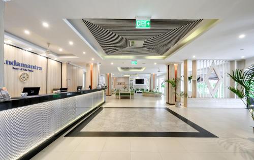 a lobby of a hospital with a reception counter at Andamantra Resort and Villa Phuket - SHA Extra Plus in Patong Beach