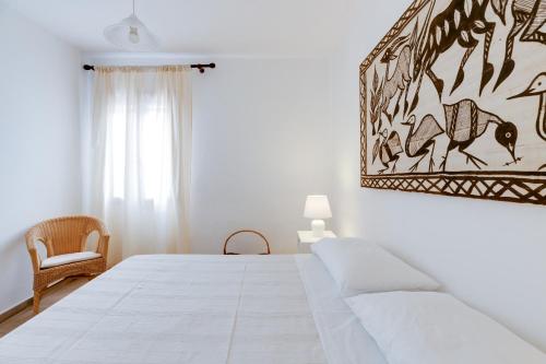 Ένα ή περισσότερα κρεβάτια σε δωμάτιο στο Babbo House Sa Rocca Tunda