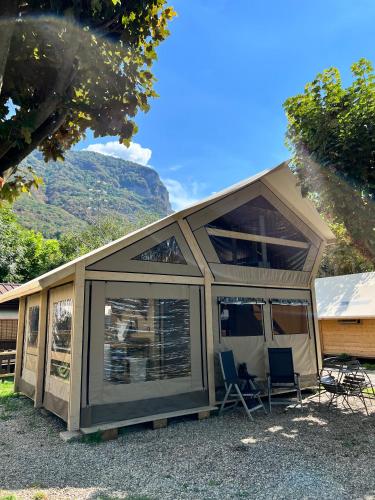 a large screened in porch of a tiny house at Glamping Camping Rivabella in Lecco