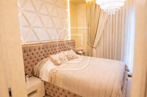 Cama ou camas em um quarto em Milenium by Kristal Collection