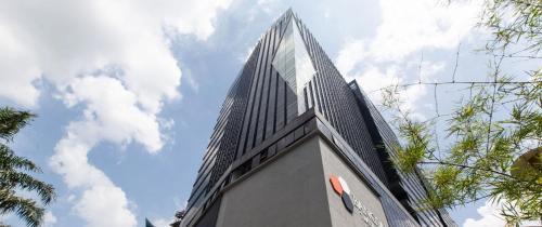 a tall building with a sky in the background at The Parkville - Bangsar Trade Centre in Kuala Lumpur