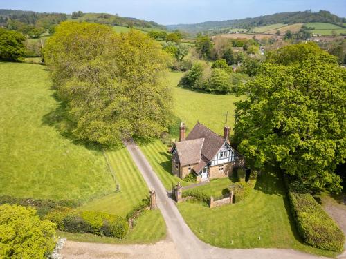an aerial view of an old house in a field at Estate Lodge Sleeps 5 on The Jurassic Coast Devon in Sidbury