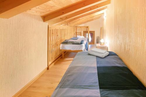 a bedroom with two beds in a room at Baita Florin in Livigno