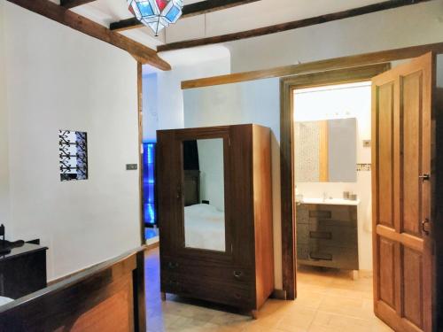 a bathroom with a mirror and a sink at One bedroom apartement with city view enclosed garden and wifi at Granada in Granada