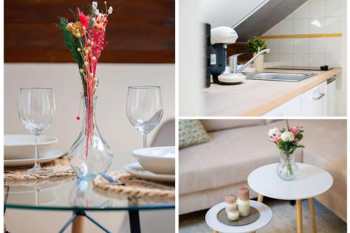 une table avec un vase de fleurs et une table avec des verres dans l'établissement Le Cocon Proche Paris Stellantis, à Poissy