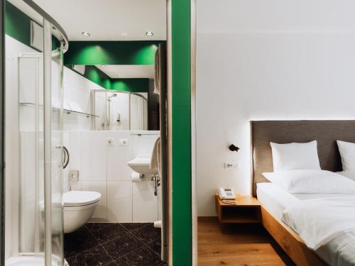Postel nebo postele na pokoji v ubytování Gourmet - Boutique Hotel Tanzer