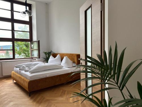 Postel nebo postele na pokoji v ubytování Pension l'Etage