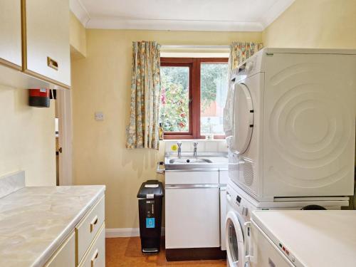 Kuchyň nebo kuchyňský kout v ubytování Bramley Cottage