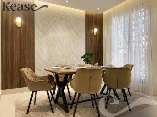 a dining room with a table and chairs at Kease Tawun A1-8 Royal touch Balcony GZ41 in Riyadh
