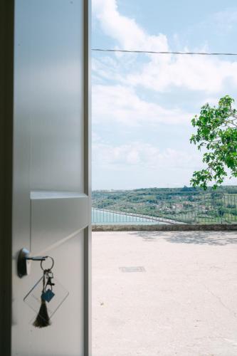 a door knob with a view of a field at CasaCeciliamare in Ortona