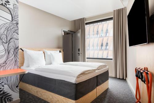 Postel nebo postele na pokoji v ubytování Heymo 1 by Sokos Hotels