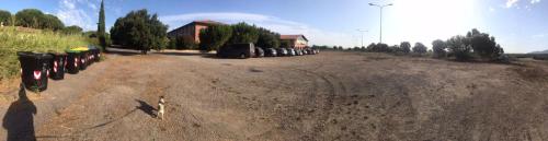 a parking lot with a bunch of parking meters at Residence il Tombolo in Principina a Mare