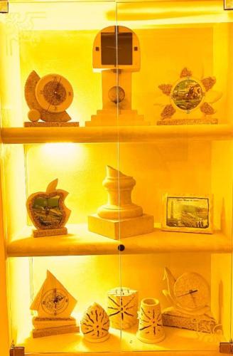a shelf filled with lots of vases and other items at Affittacamere 2 Mari in Marina di Leuca