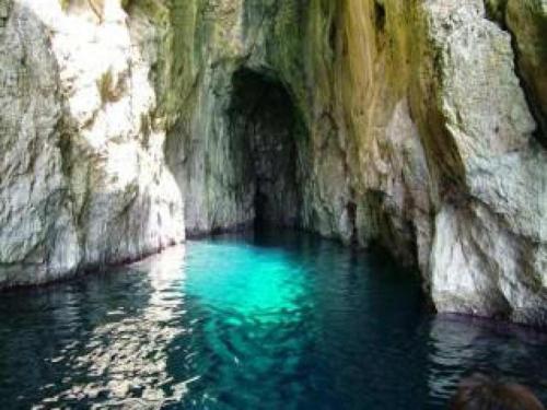 a pool of blue water in a rock cave at Affittacamere 2 Mari in Marina di Leuca
