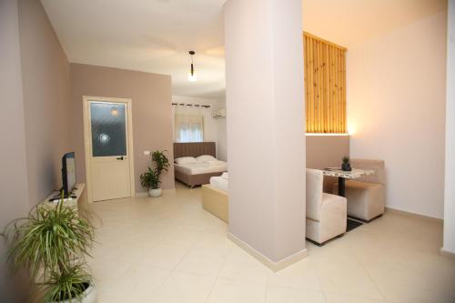 a large room with two beds and a table at TekB Rooms & Apartments in Vlorë