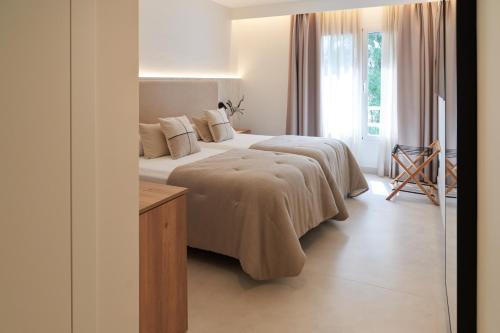 Säng eller sängar i ett rum på Hotel-Restaurante Jardines La Tejera