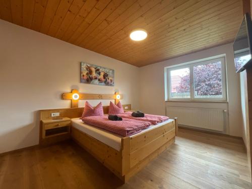 Postel nebo postele na pokoji v ubytování Gästehaus Schwaiger