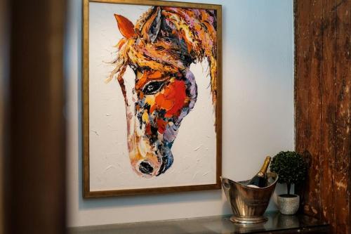 a painting of a horse on a wall at The Old Stables in Newcastle upon Tyne