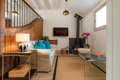 a living room with a bed and a table at The Old Stables in Newcastle upon Tyne