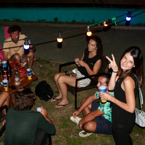 a group of people sitting around in a tent at Dodo House auberge de jeunesse in Saint-Leu