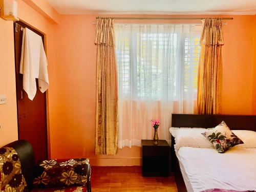 Llit o llits en una habitació de Arusiya Apartment