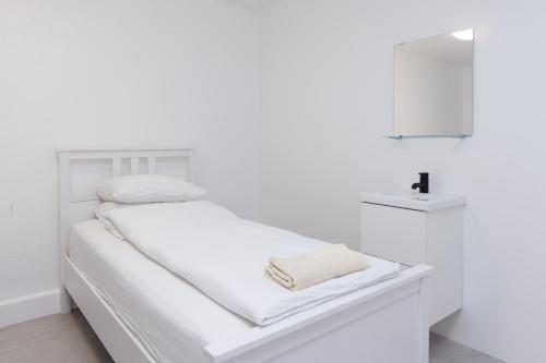 Ένα ή περισσότερα κρεβάτια σε δωμάτιο στο Summerday Guesthouse