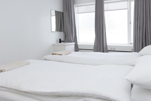 Ένα ή περισσότερα κρεβάτια σε δωμάτιο στο Summerday Guesthouse