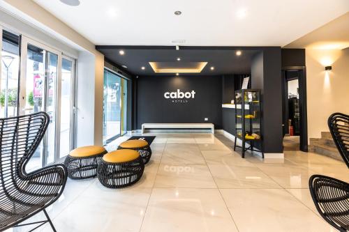 a store lobby with chairs and a clothing store at Cabot Playa Grande - Adults Only in Playa de Palma