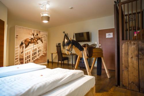 Ένα ή περισσότερα κρεβάτια σε δωμάτιο στο Landhotel Beverland bei Münster