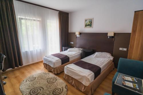 Postel nebo postele na pokoji v ubytování Hotel Dobsi
