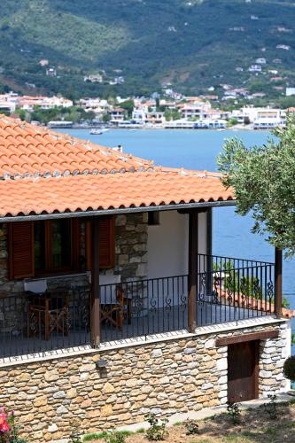 a house with a balcony with a view of the water at Villa Lazareta in Punta