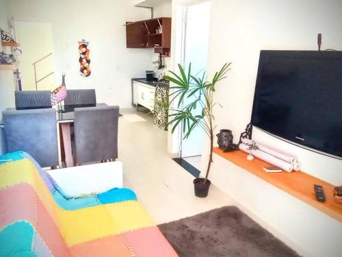 a living room with a large flat screen tv at ap3 apropriado para arbnb! in Itatiba