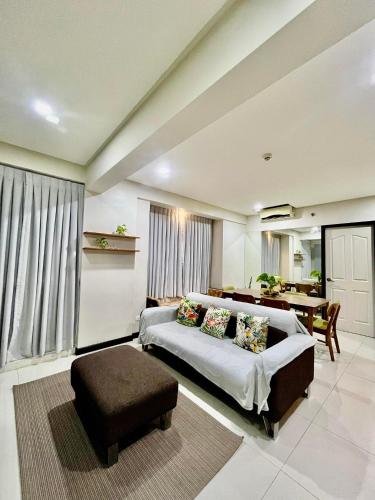 a living room with a bed and a table at Kelsey's Homestay in Davao City