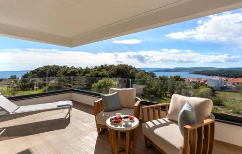 a living room with a view of the water at Villa Punat Hills With Pool 1 in Punat