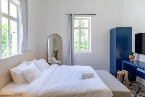 Mila - Boutique Hotelにあるベッド