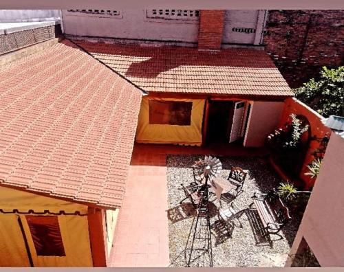 an overhead view of a house with a windmill at Hostal Las Carretas in San Miguel de Tucumán