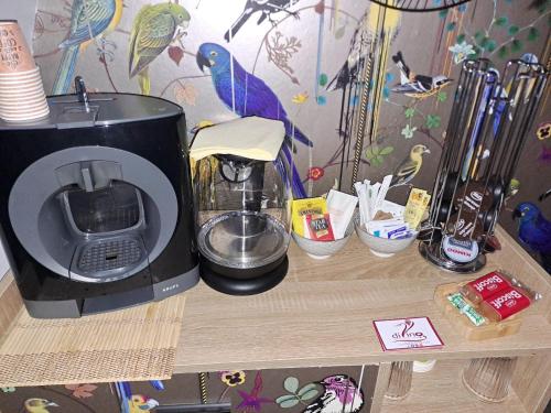 a counter with a coffee maker on a table at Maison Divino in Trani