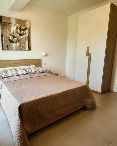 Кровать или кровати в номере Gloria House