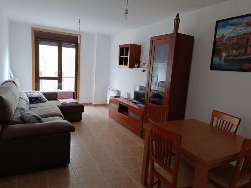 a living room with a couch and a table at Mi Morada - Apartamento in Lalín