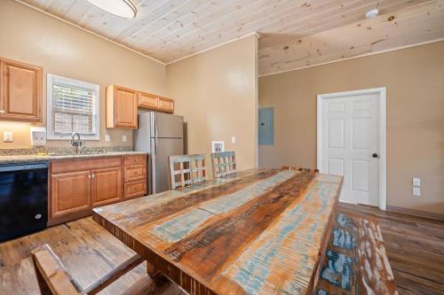 a large kitchen with a large wooden counter top at Carr's Northside Hotel and Cottages in Gatlinburg
